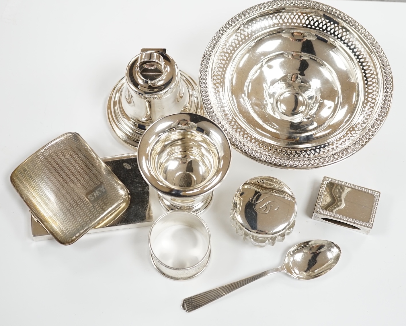 Sundry small silver including a bell shaped inkwell, modern card case, cigarette case, small spoon, napkin ring, pill box, sterling bowl etc.
